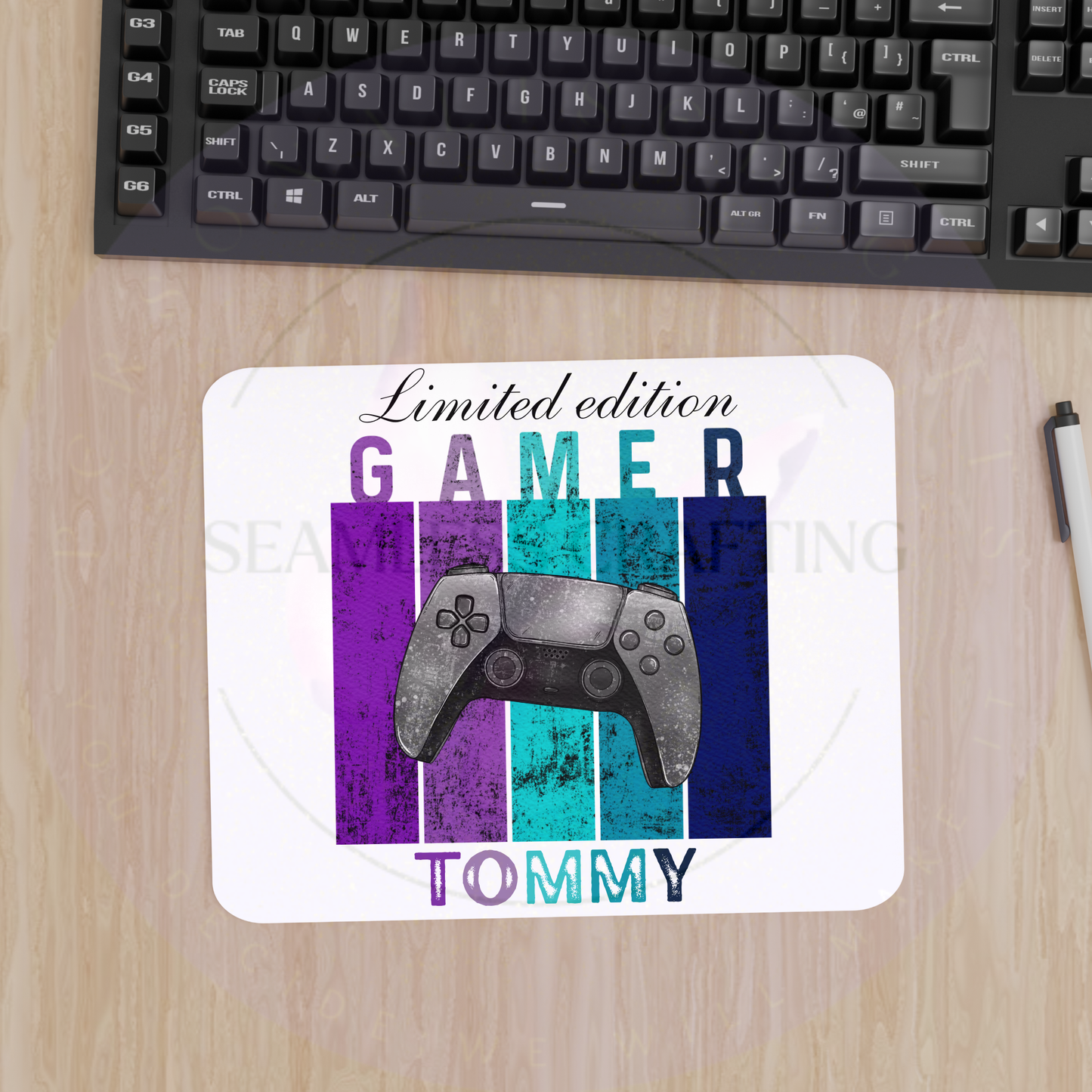 Custom name gaming mouse mat displayed on computer desk with keyboard and mouse
