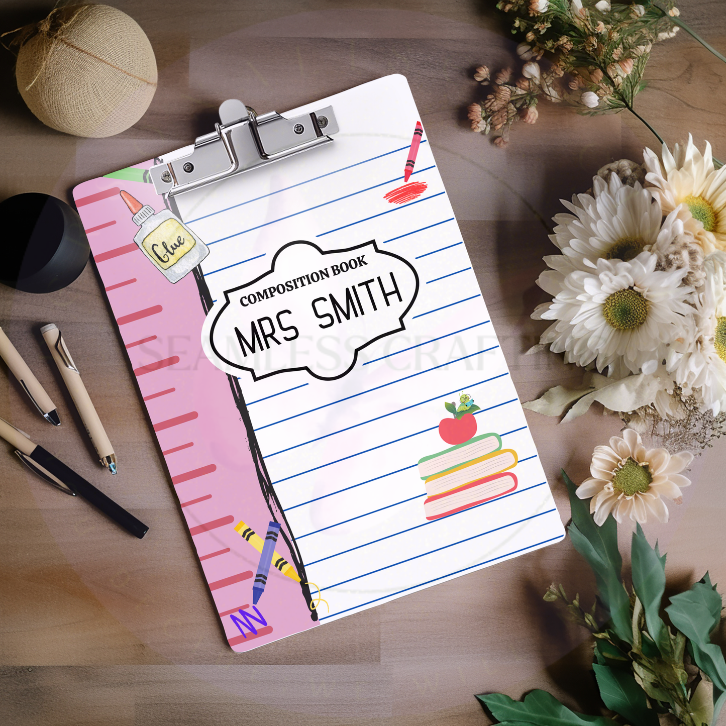 Angled view of custom composition book clipboard with teacher name and school design