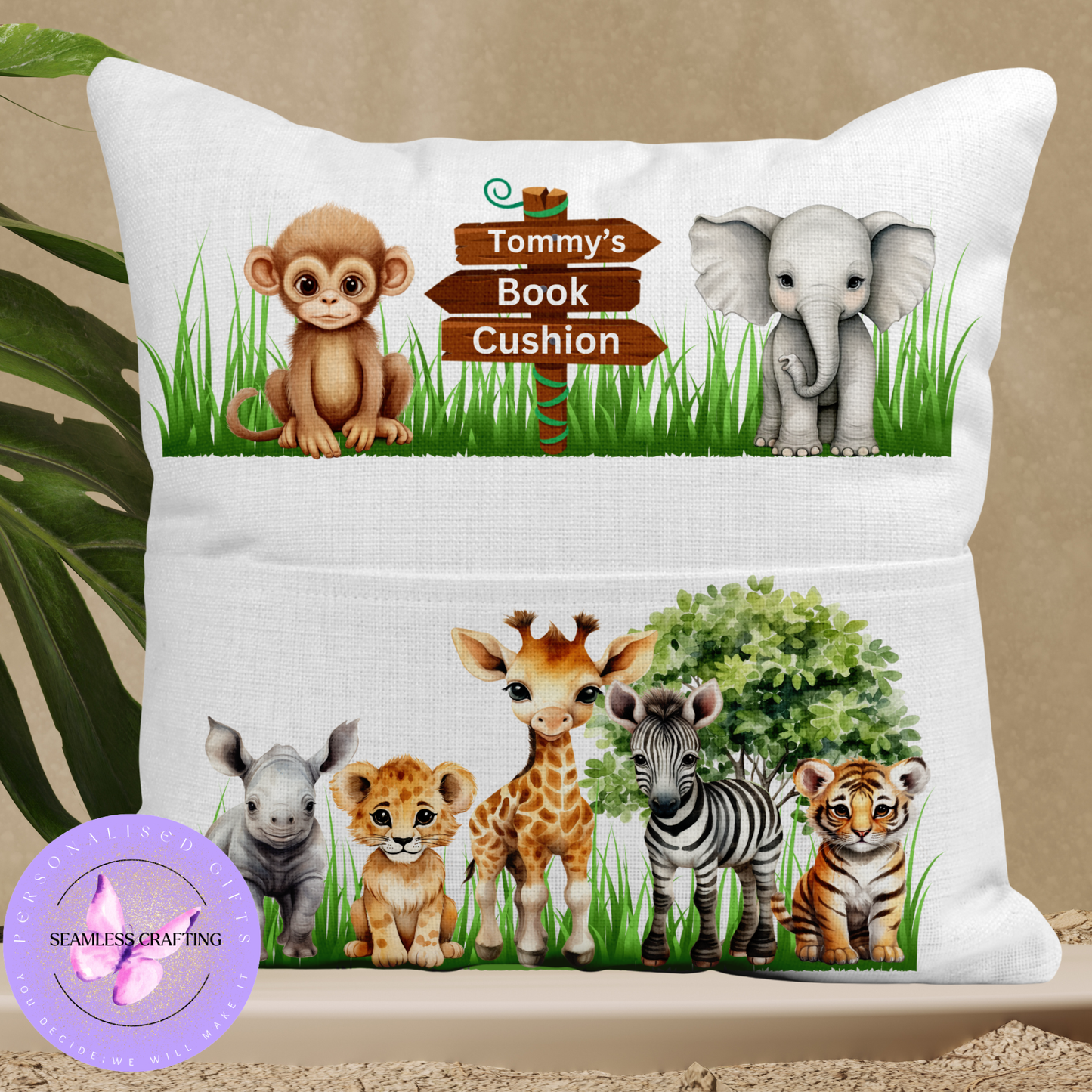 Personalised safari animal cushion for kids. Handmade linen book pocket pillow, perfect for jungle nursery decor or reading corner. Made in the UK.