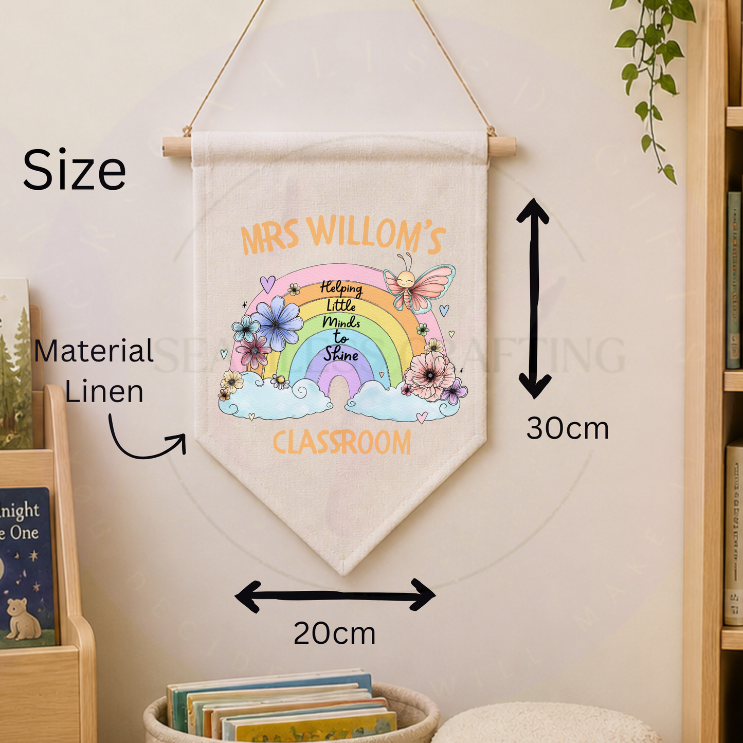 Flat lay of personalised classroom banner on rustic wooden background with woodland animal design and teacher name.