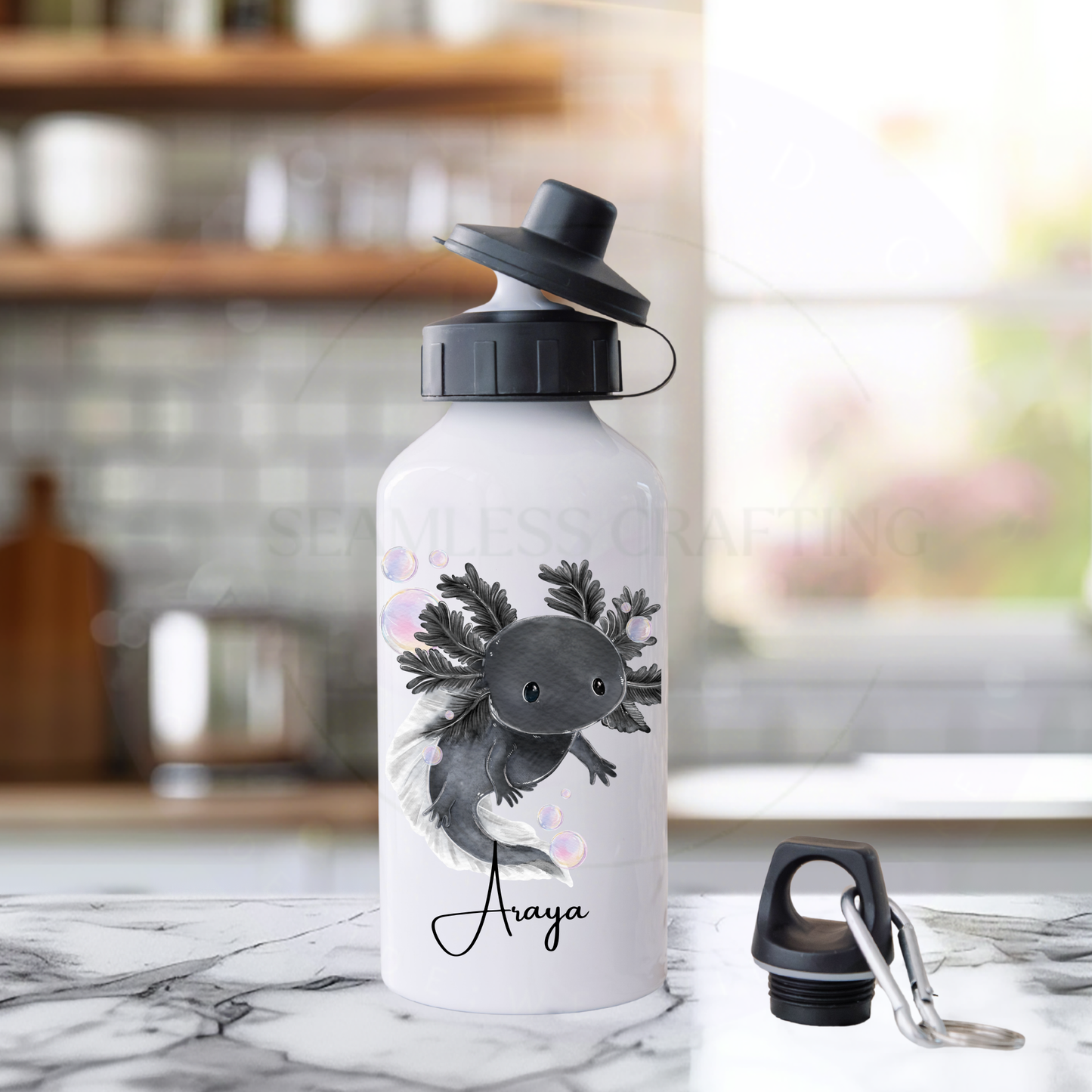 Personalised kids water bottle with axolotl illustration and name printed reusable aluminium bottle