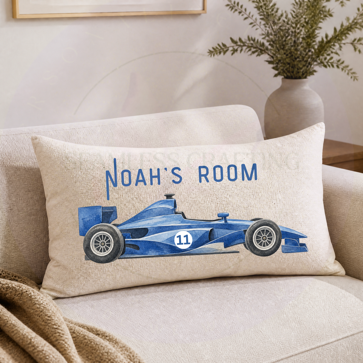 Personalised blue racing car cushion 50x30cm in linen with custom Noah's Room name and Formula style design