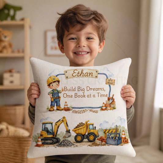 Personalised digger reading cushion with book pocket, builder character, construction vehicles and custom name Ethan