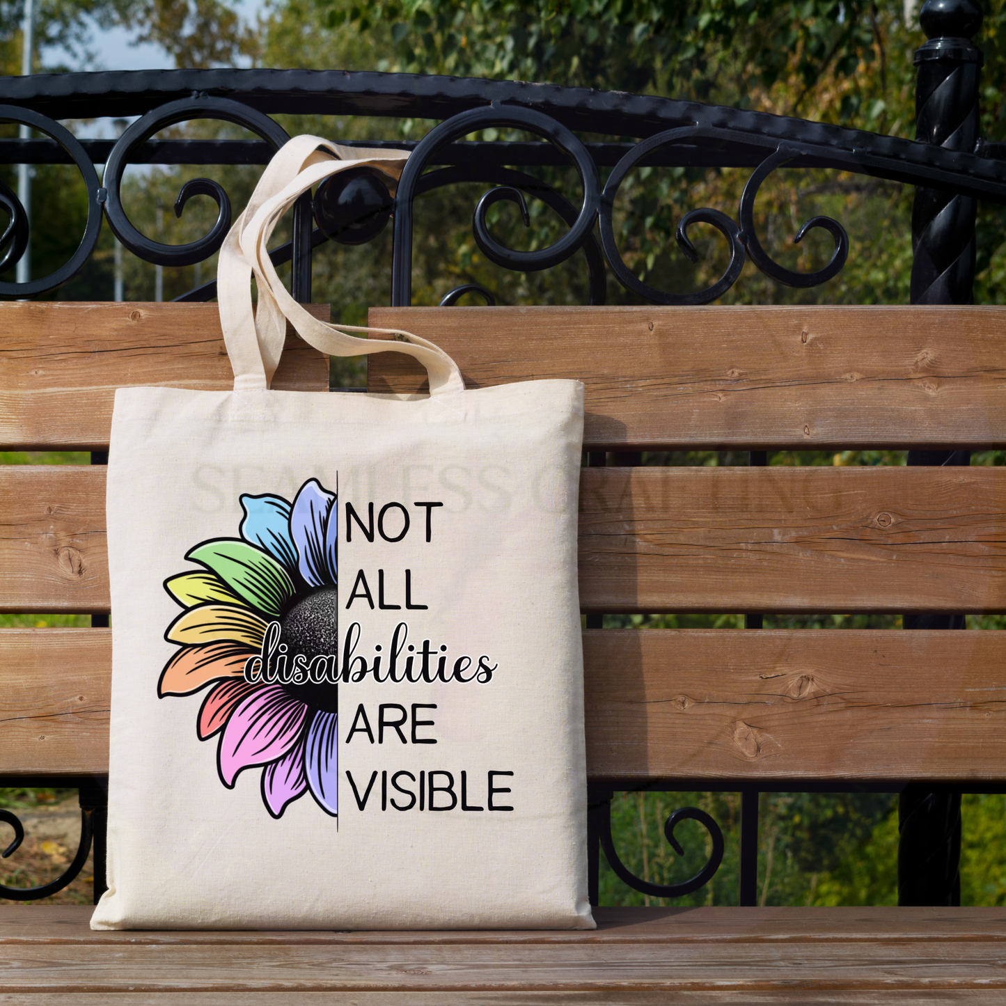 Lifestyle image of disability awareness tote bag on bench