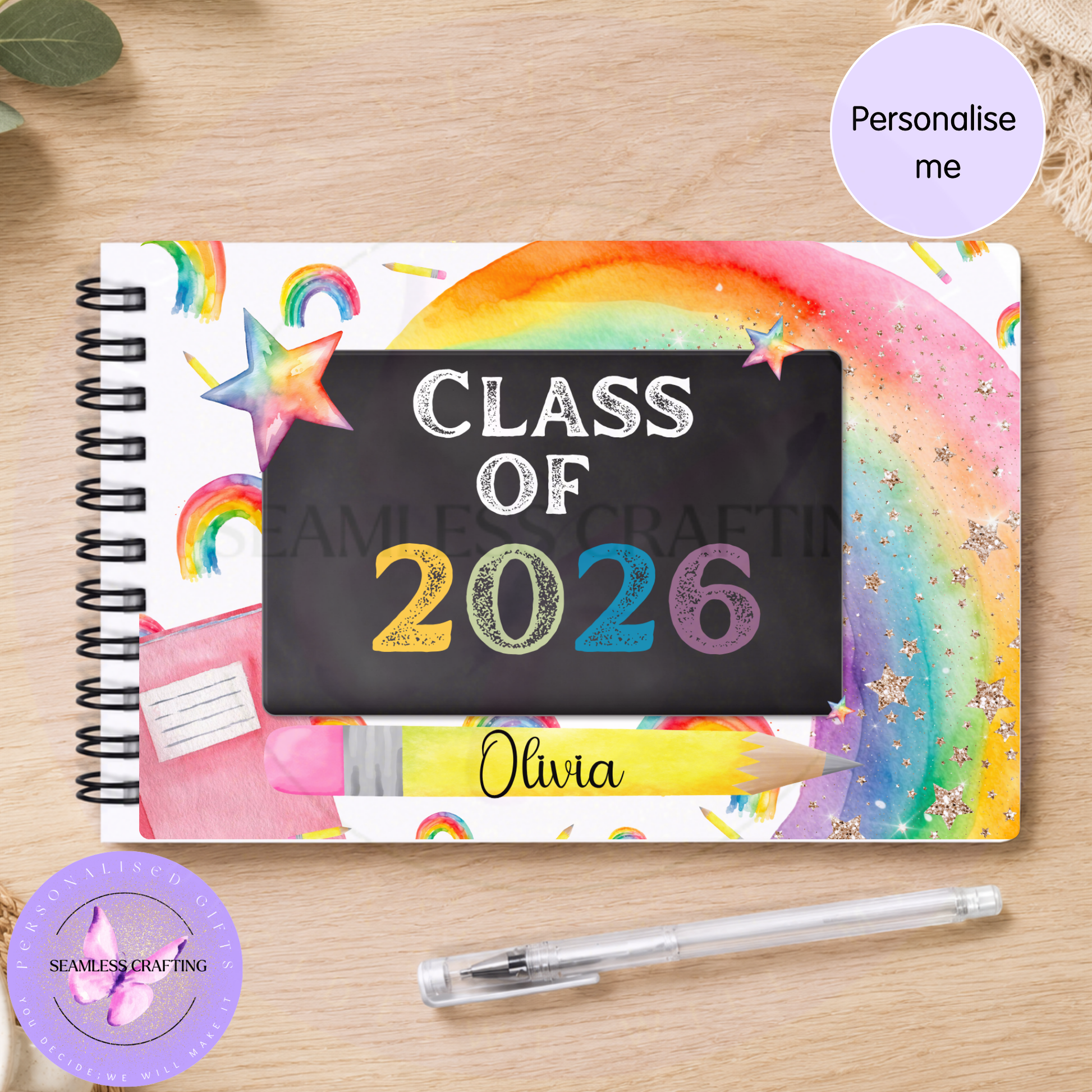 Personalised rainbow Class of 2026 spiral notebook flat lay with name Olivia and pen