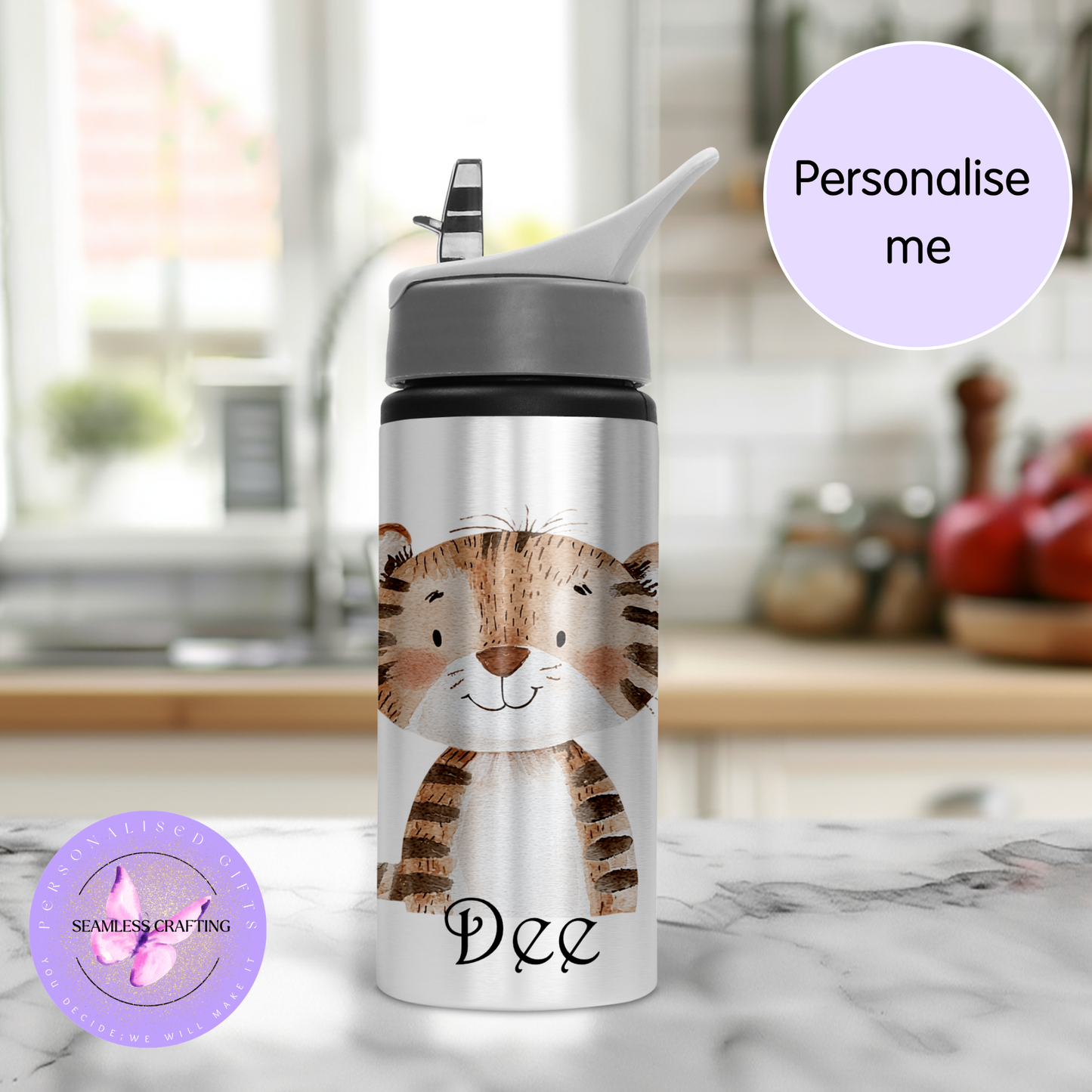 Water bottle with a tiger design and the name 'Dee' on a marble surface.