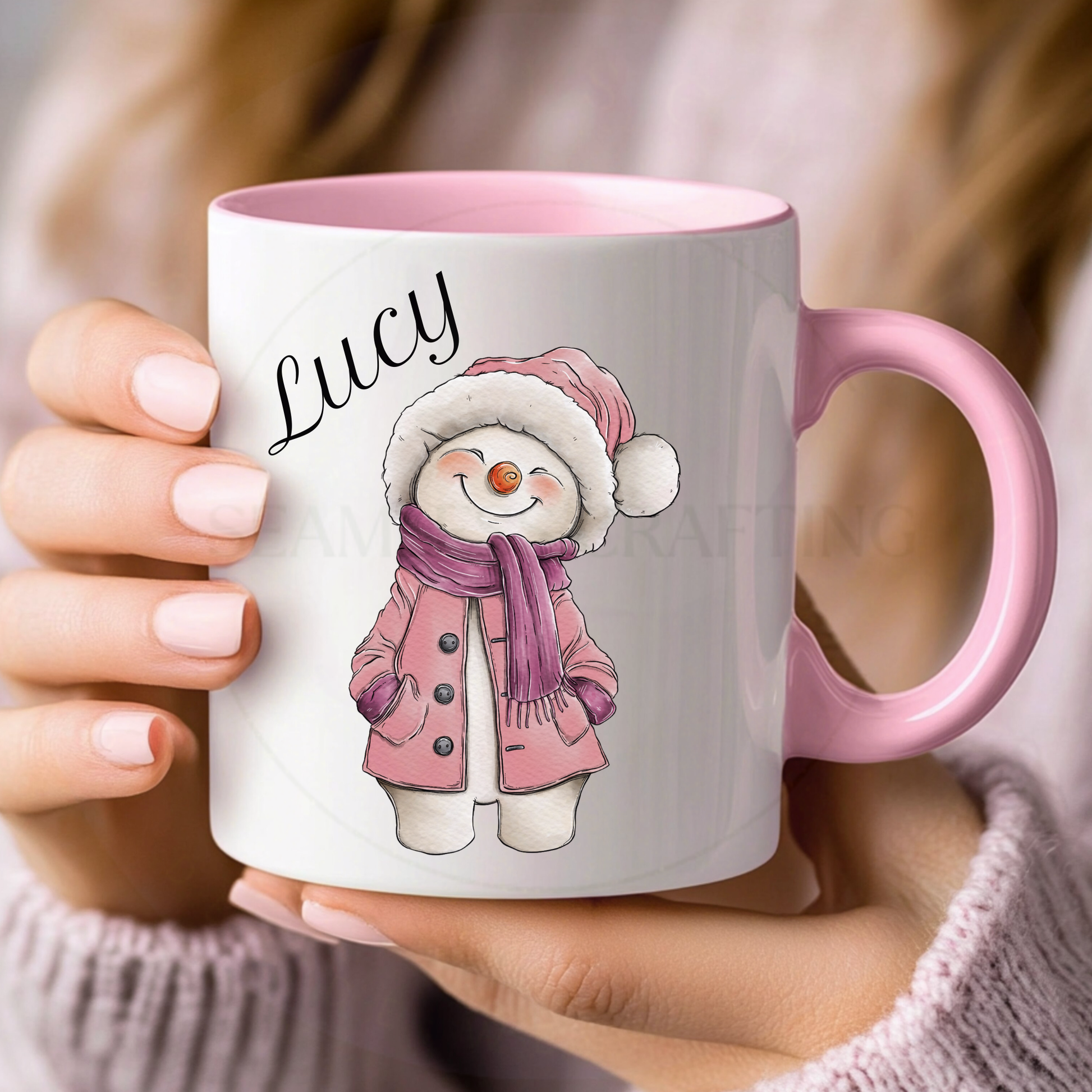Personalised pink-handle Christmas mug with the name Lucy and a pink snowman design