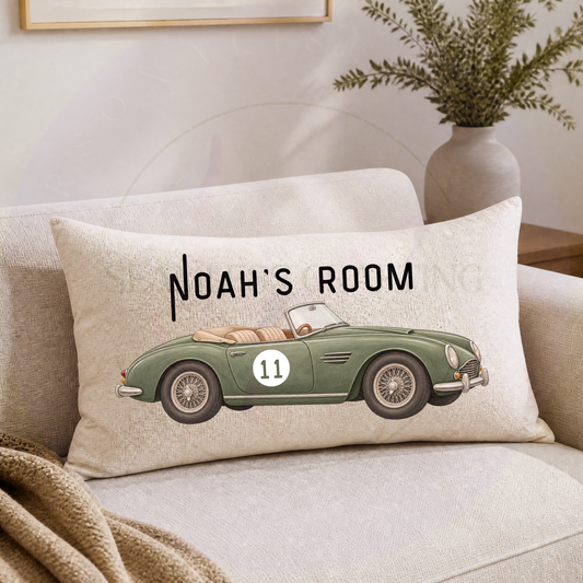 Personalised vintage sports car cushion with custom name, classic green convertible and linen finish