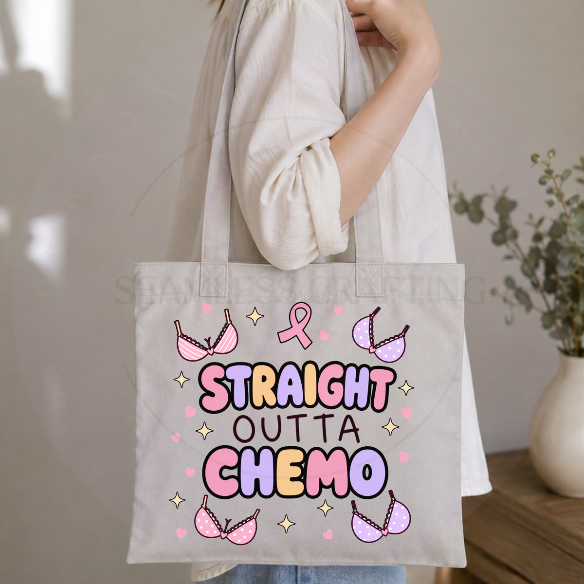 Woman carrying a Straight Outta Chemo tote bag over her shoulder indoors