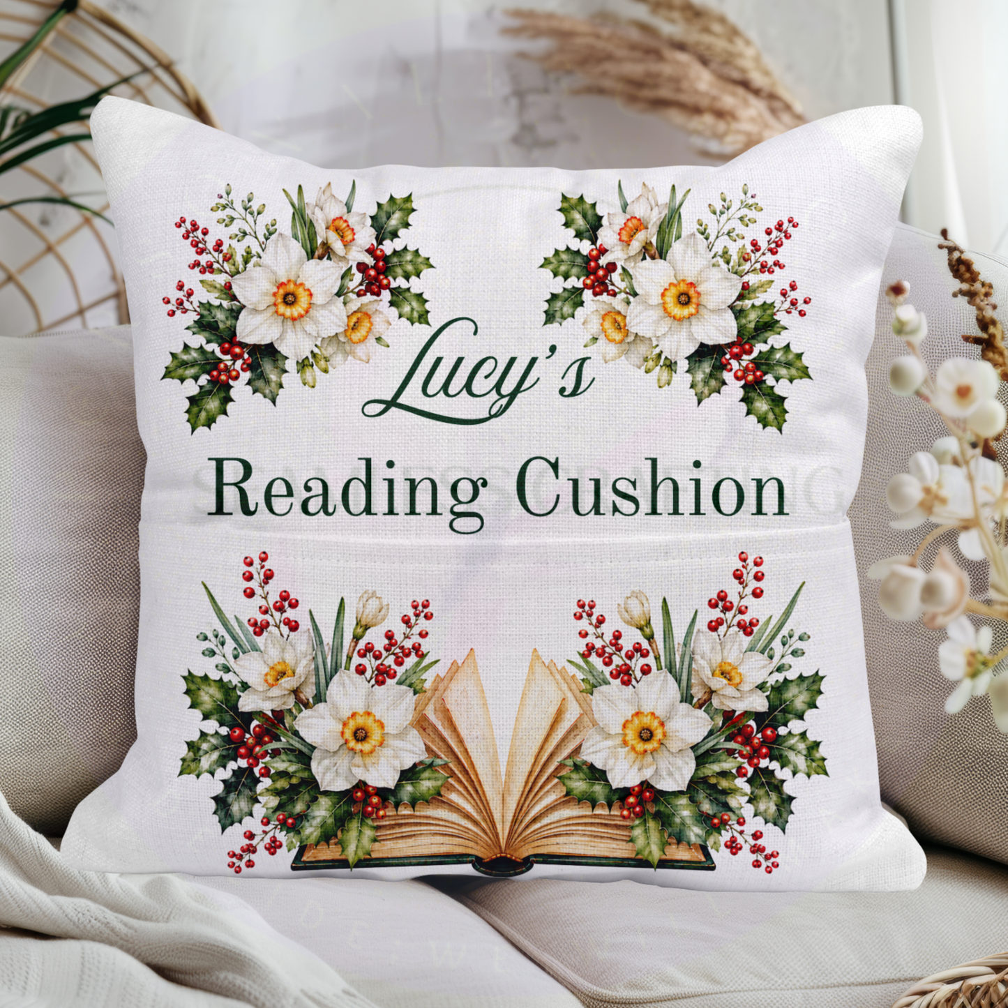 December birth flower reading cushion with personalised name, white narcissus flowers, holly and open book
