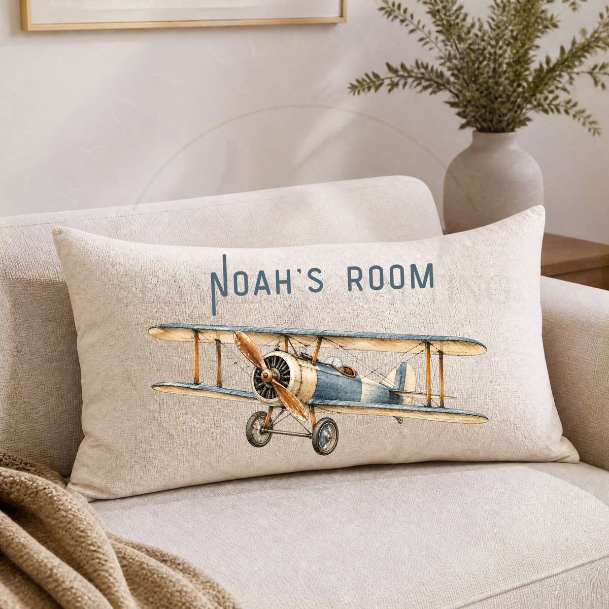 Personalised aeroplane cushion featuring blue and cream vintage biplane with custom name