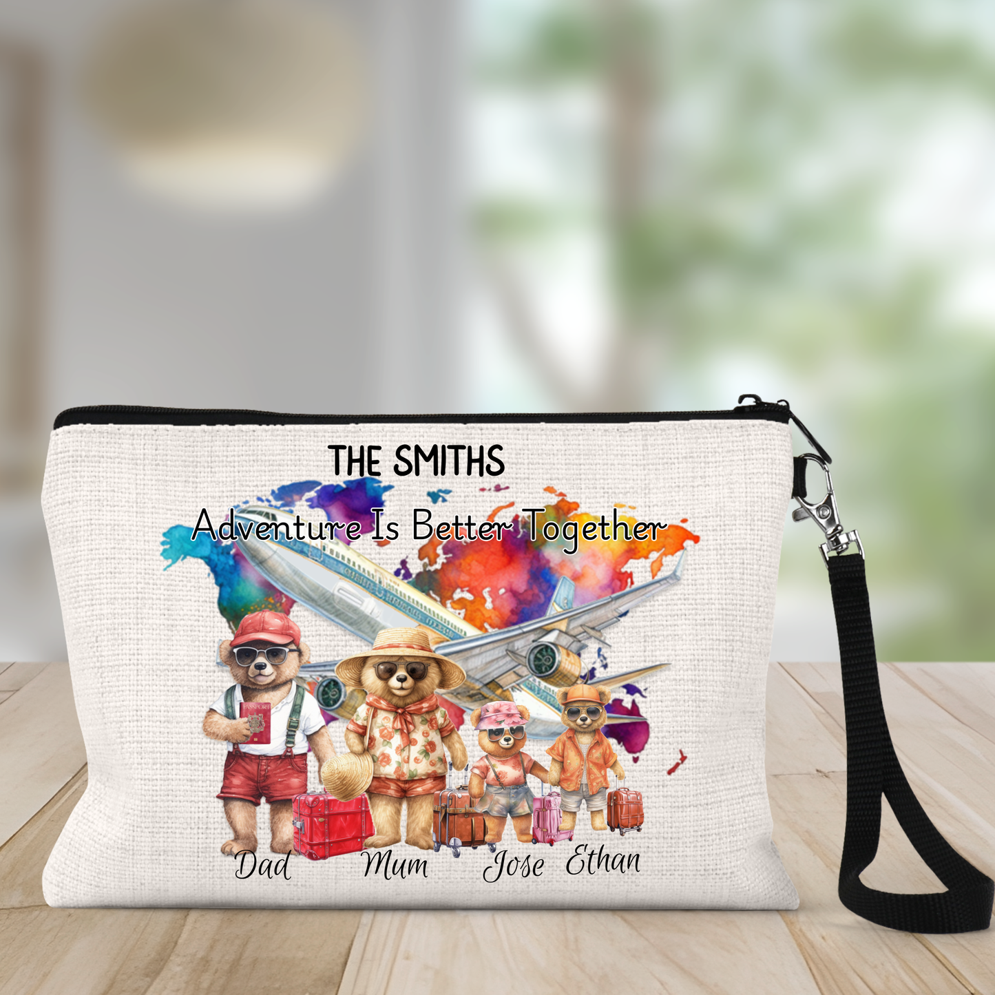 Pouch with teddy bears and airplane design, personalized with names, on a wooden surface.