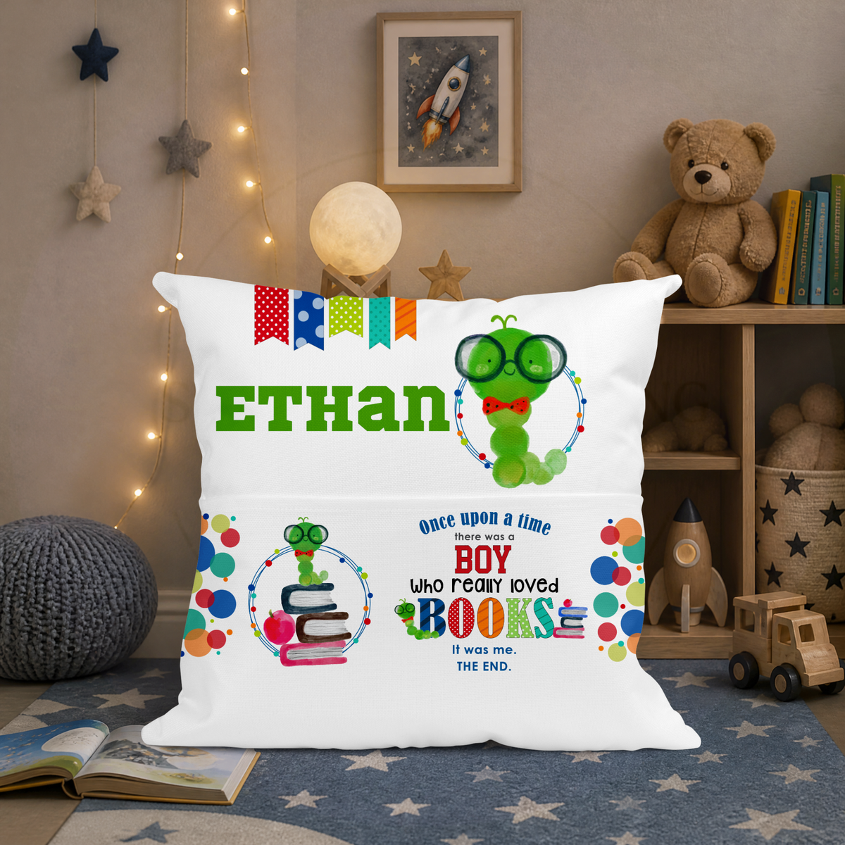 Personalised boys reading cushion displayed in children's bedroom with book pocket