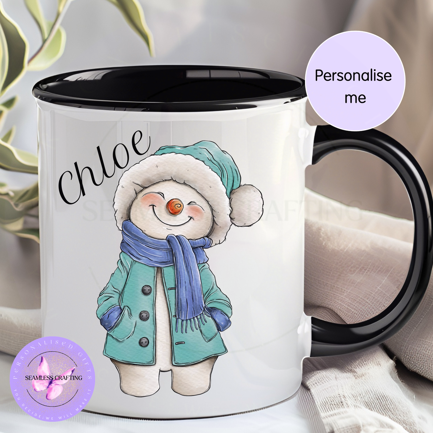 Personalised black-handle snowman Christmas mug with the name Tommy and green winter outfit
