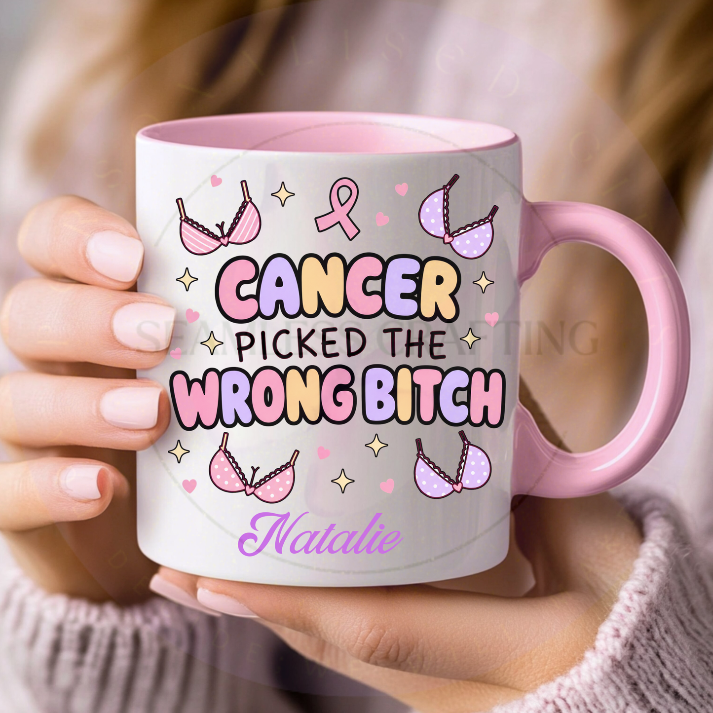 Close-up of pink handle breast cancer survivor mug personalised with the name Natalie