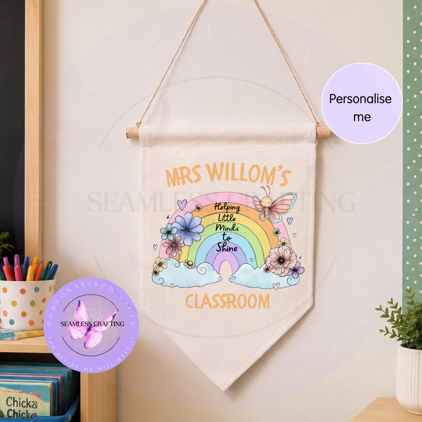 Personalised teacher classroom banner displayed on nursery wall with bookshelf and pastel classroom decor.