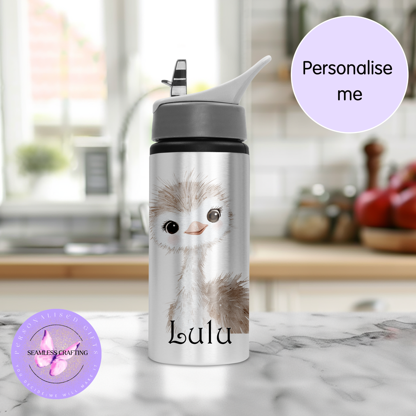 Water bottle with a cute ostrich design and 'Lulu' text, set against a blurred kitchen background.