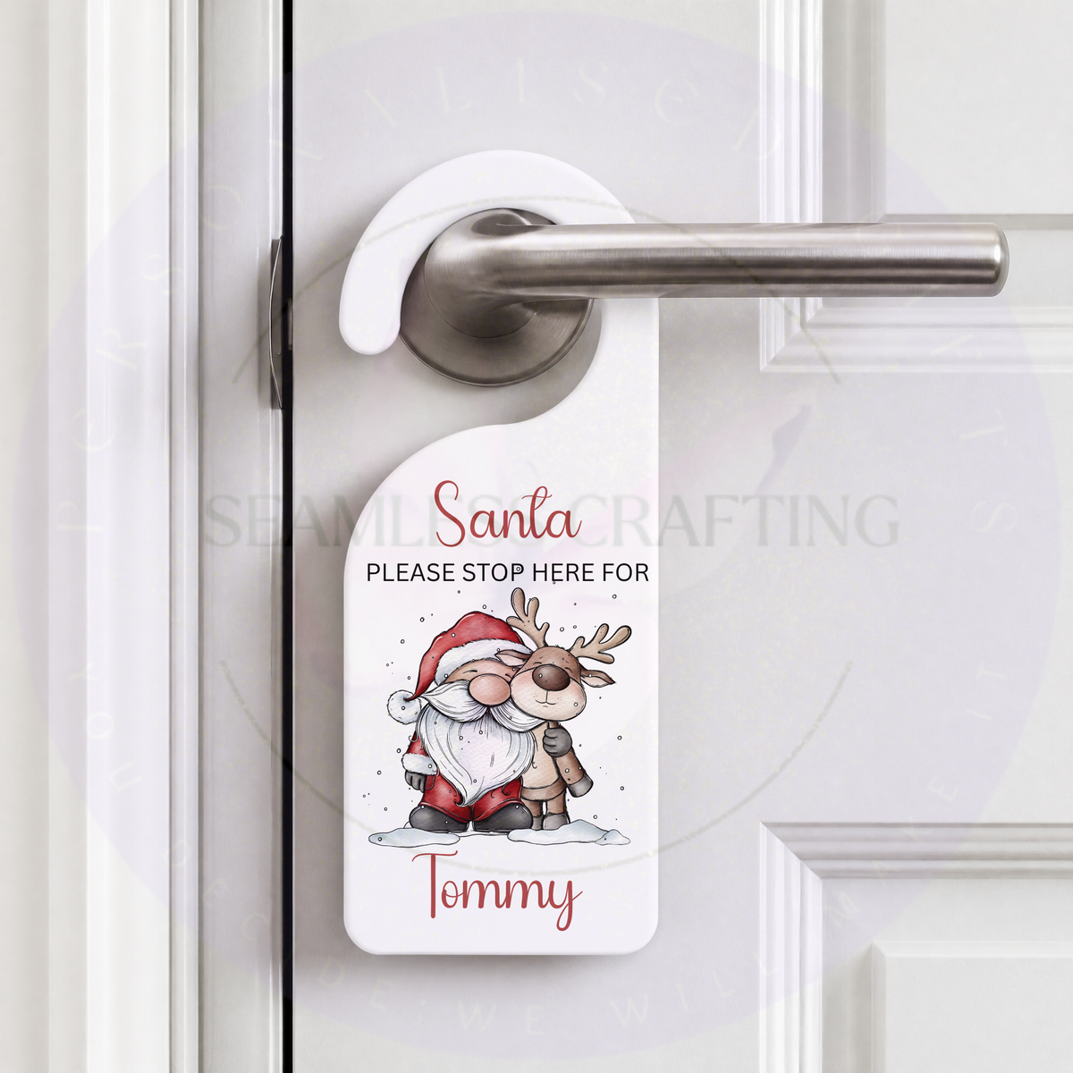 Personalised Santa and reindeer Christmas door hanger with custom name Tommy hanging from door handle