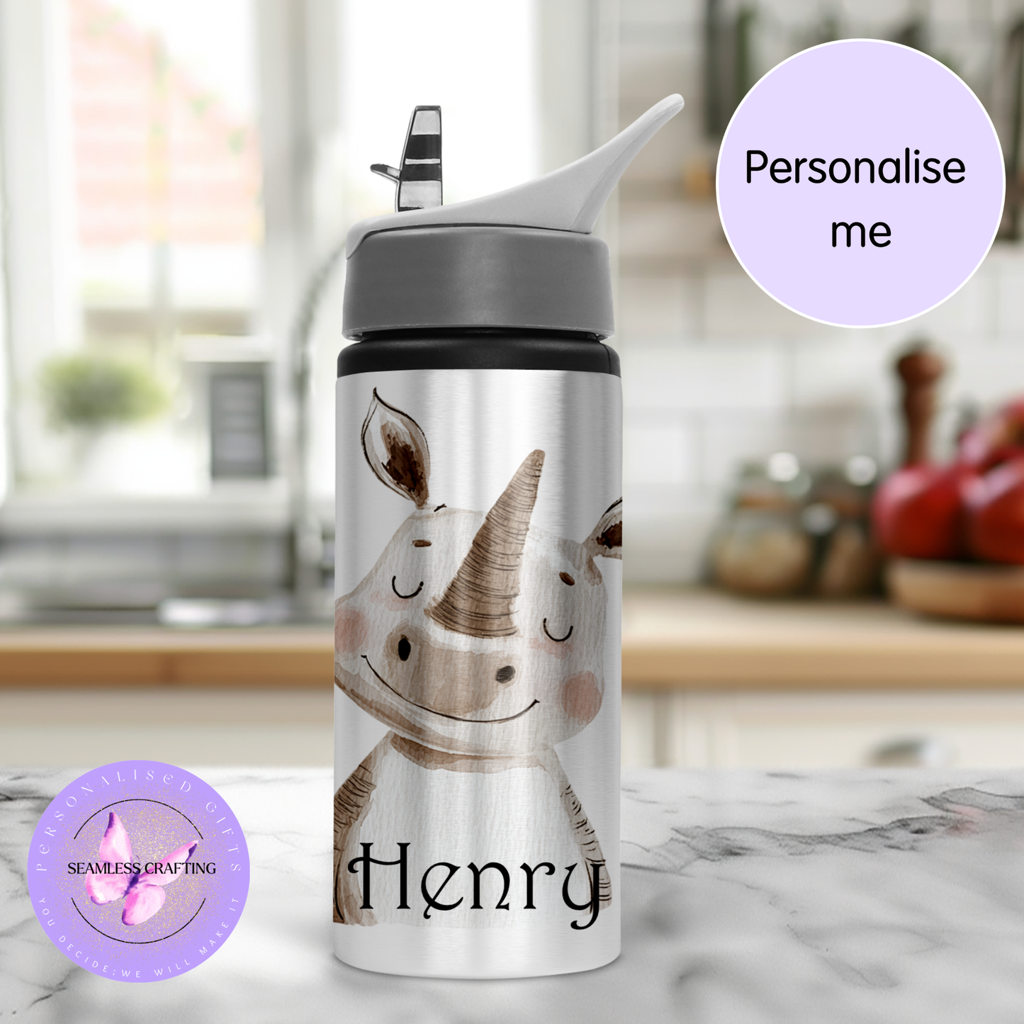 Water bottle with rhino design and 'Henry' text on a kitchen counter.