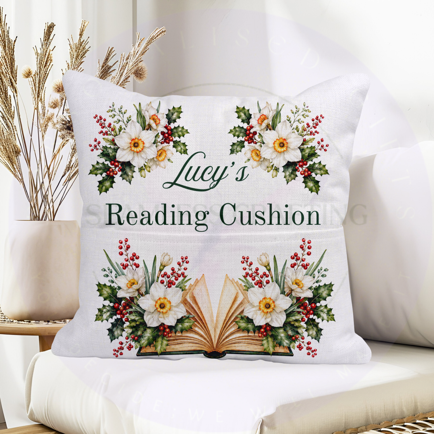 December birthday reading cushion with personalised name, narcissus flowers, red holly berries and open book