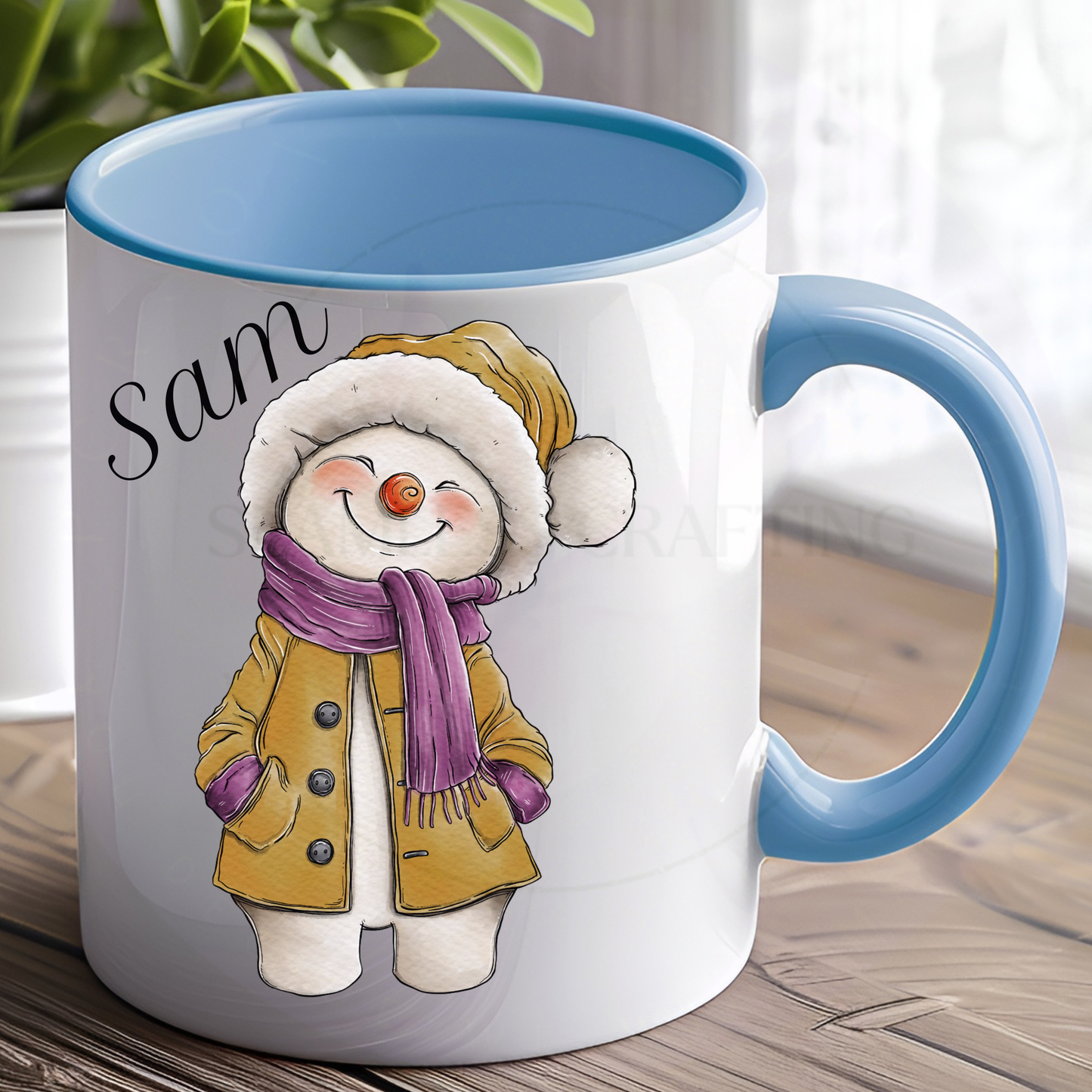 Personalised blue-handle Christmas mug with the name Sam and a mustard snowman outfit