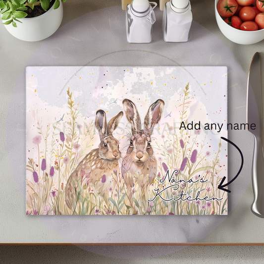 Personalised glass chopping board with spring hare design and custom name, kitchen worktop saver gift